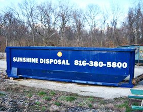 Roll off dumpster rental sitting on job site