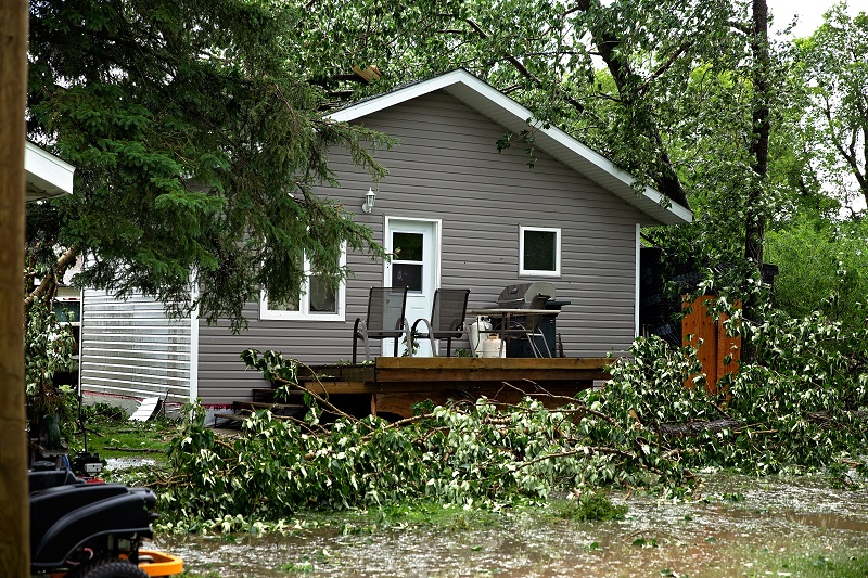 A roll off dumpster makes cleaning up easy after high winds, hard rain, and even tornadoes make a huge mess in your yard.